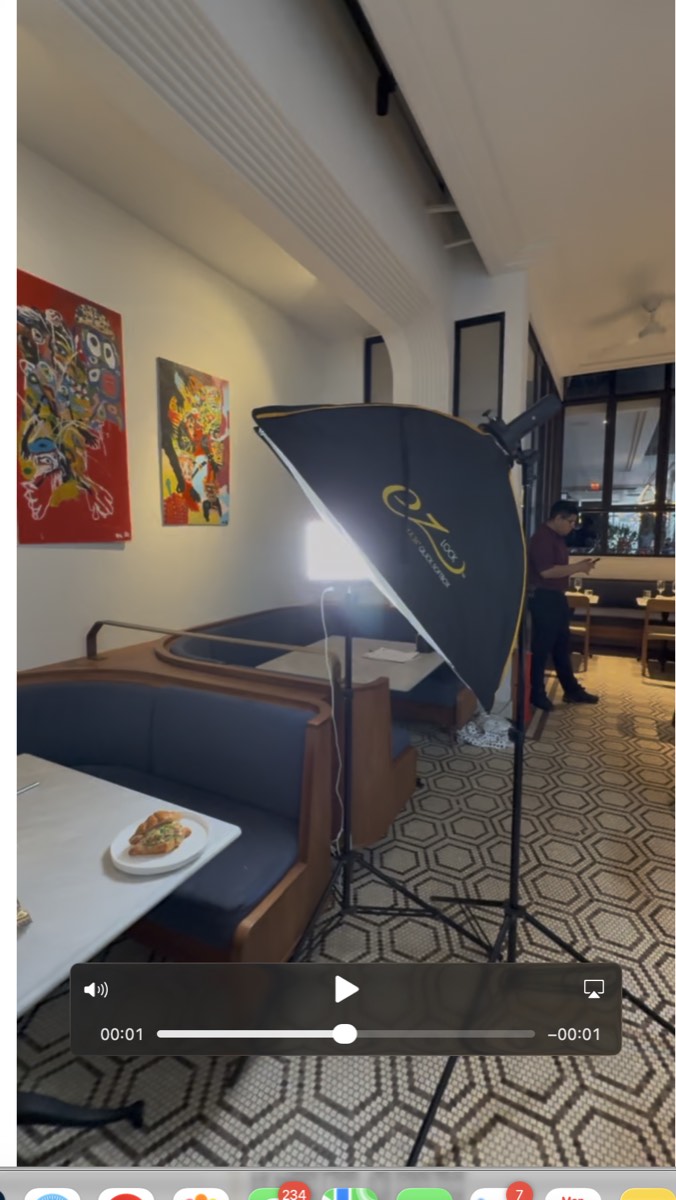 Foreign Kollective lighting a dish on location inside a Brooklyn restaurant